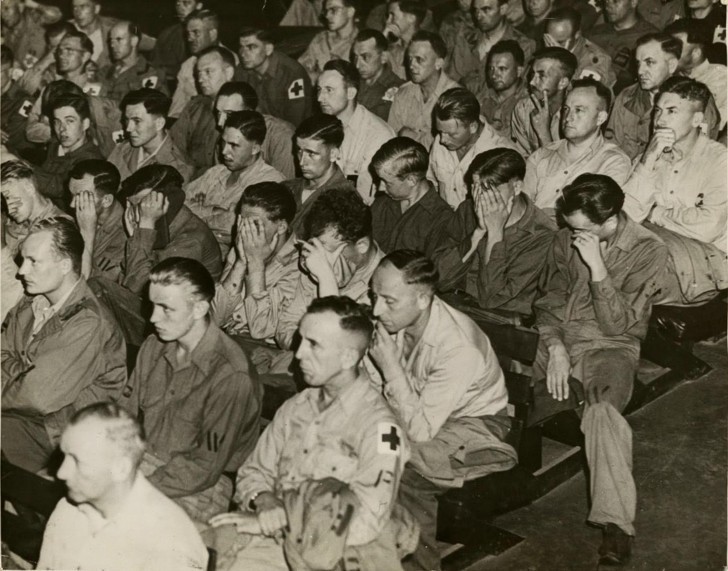 German soldiers react to images of concentration camps from 1945